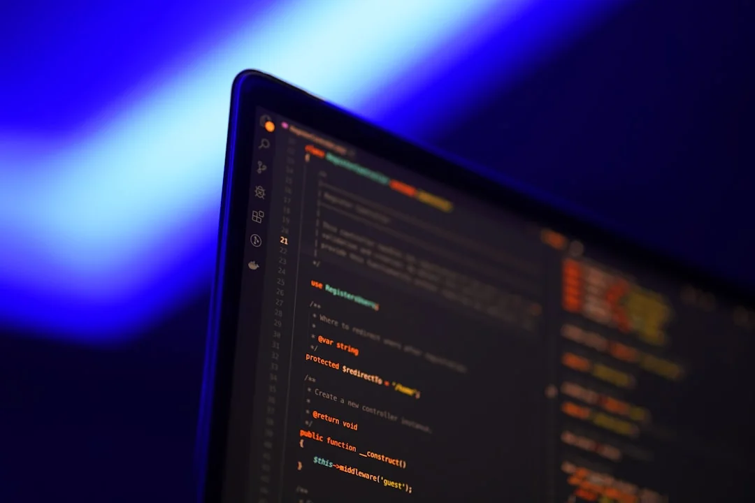 OpenAI Website with Introduction to ChatGPT on Computer Monitor